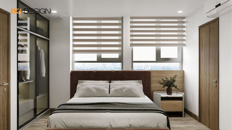 Phòng ngủ chính căn hộ 60m2 với tủ áo âm tường và giường đôi